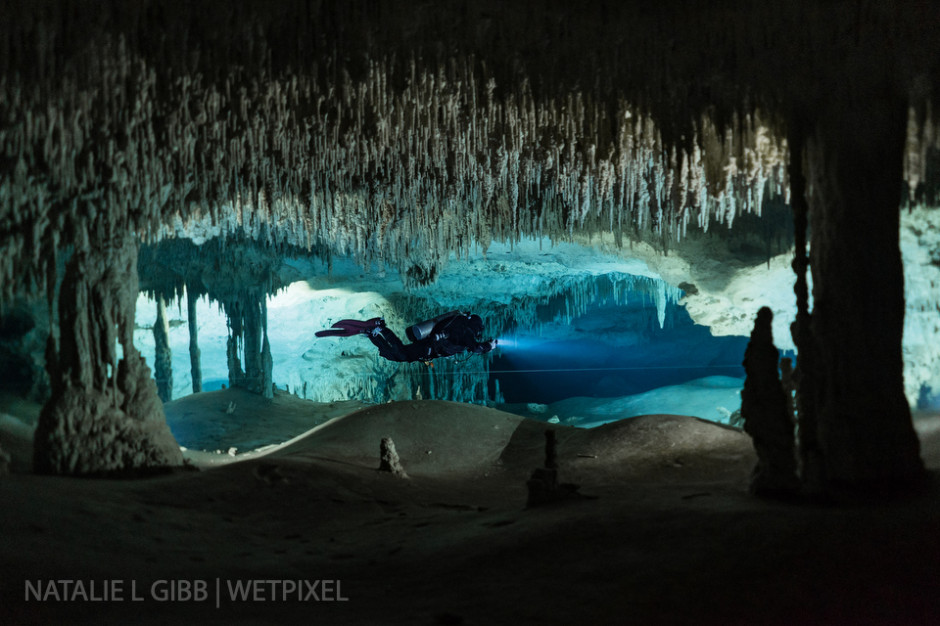 Lights placed behind the columns create window into another world with Joe Fellows at Cenote Nohoch Nah Chich.