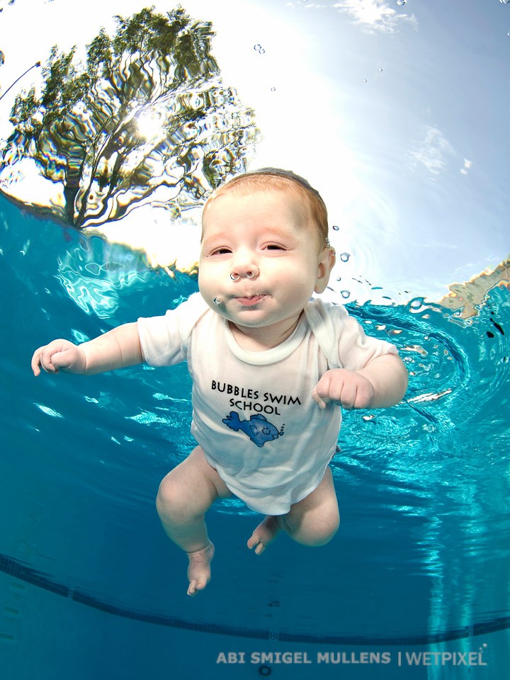An elusive and fleeting photo subject, a 5-month old baby comfortable in the water.