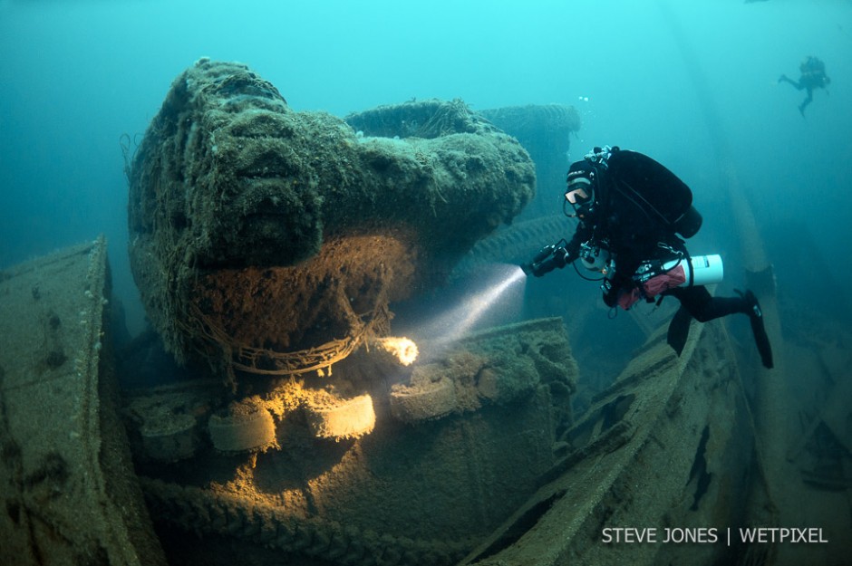 Sherman tanks lie entangled with trucks, spread across the wreck and seabed as far as our eyes can see on the Empire Heritage, which lies at 67 metres.