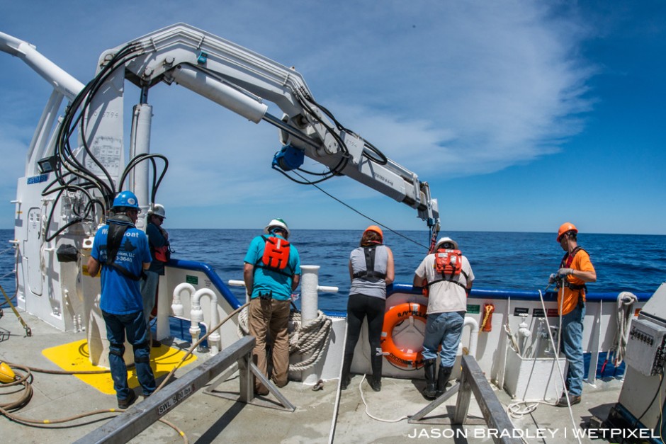 Scientists, engineers, and crew of LUMCON's (Louisiana Universities Marine Consotium) research vessel the R/V Pelican, watch Oceaneering's ROV descend into the Gulf of Mexico, and over the Mississippi Canyon.